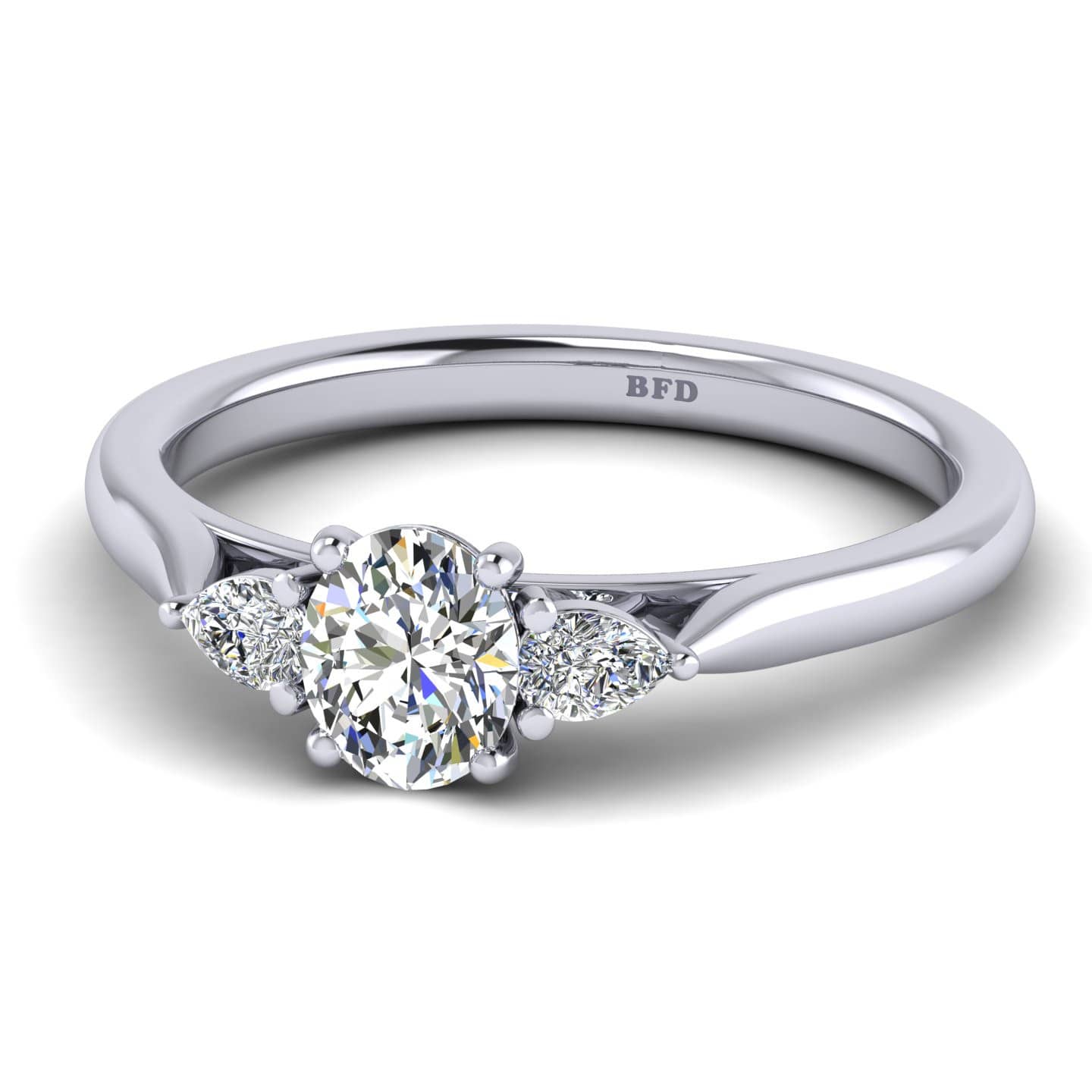 Oval And Pear Diamond Claw Set Three Stone Ring