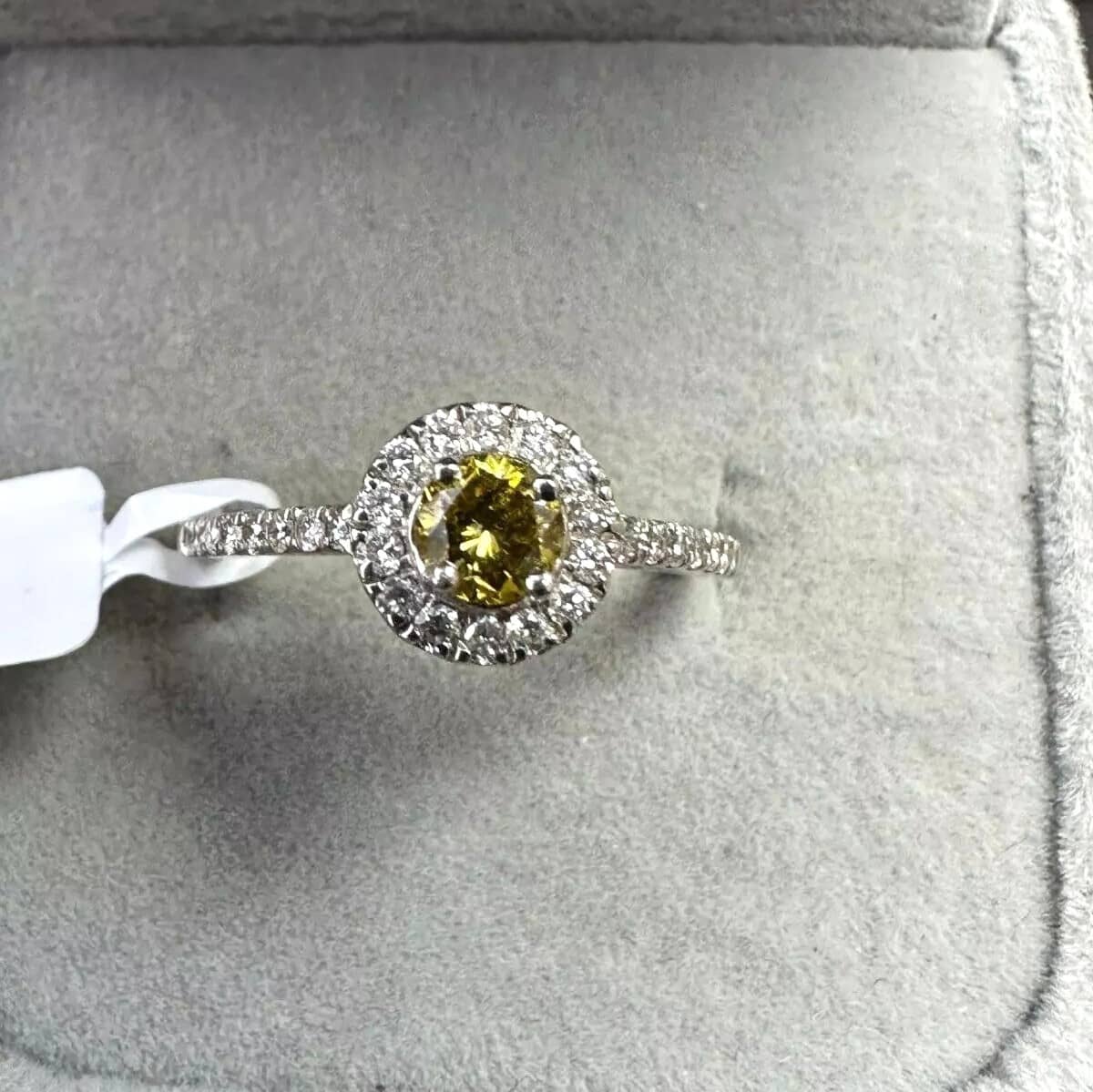 Natural Fancy Yellow 0.60Ct Diamond Halo Set Engagement Ring in Platinum