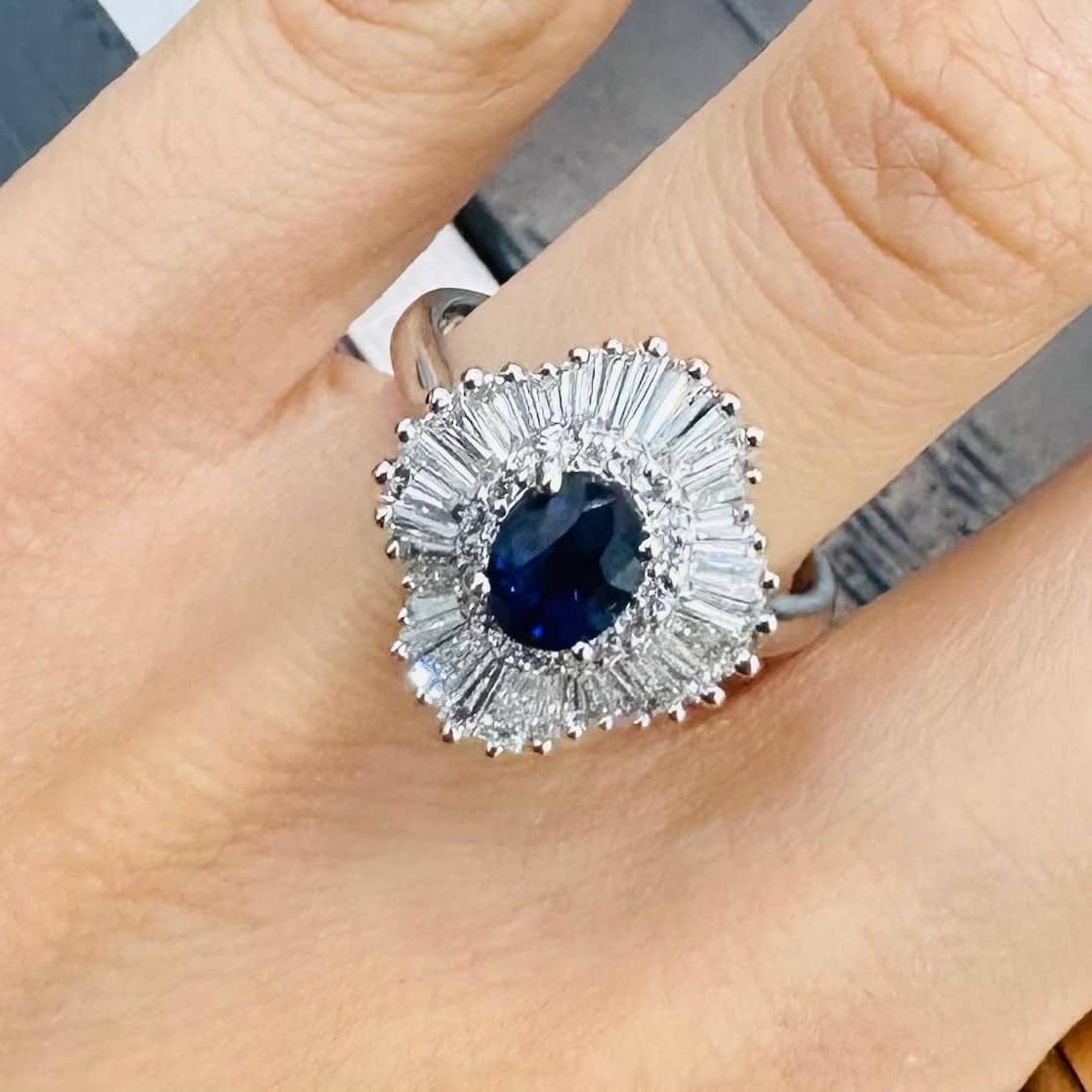 2.25 CARAT NATURAL OVAL SAPPHIRE AND SIDE DIAMOND CLUSTER HALO RING