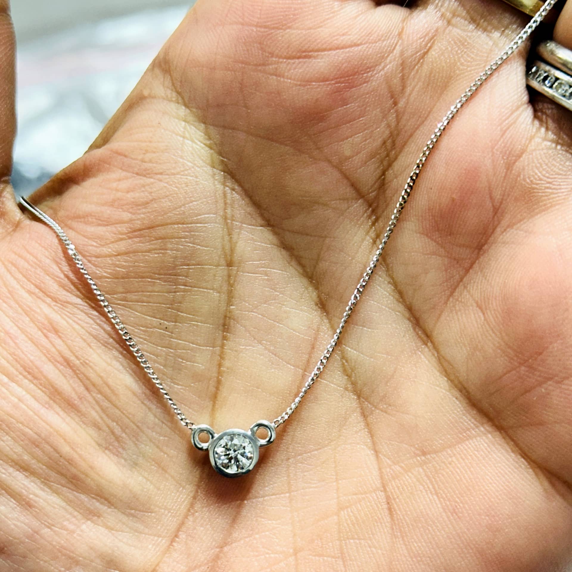 GIA CERTIFIED 0.41CARAT ROUND DIAMOND BEZEL SET PENDANT WITH CHAIN