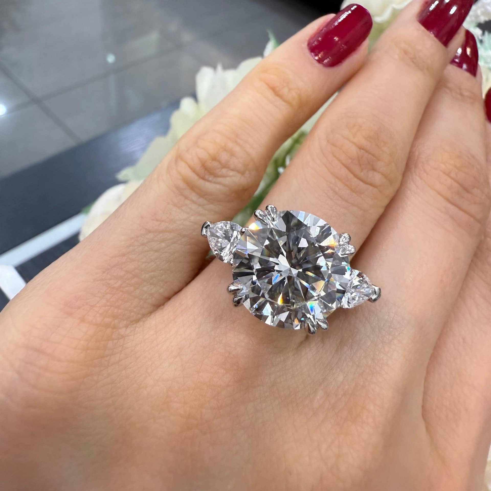 9.01 CT IGI LAB GROWN ROUND WITH SIDE PEAR DIAMOND TRILOGY RING IN PLATINUM