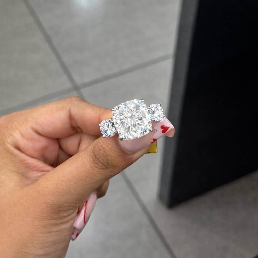 11.31 CT IGI LAB GROWN CUSHION WITH SIDE ROUND DIAMOND TRILOGY RING IN PLATINUM